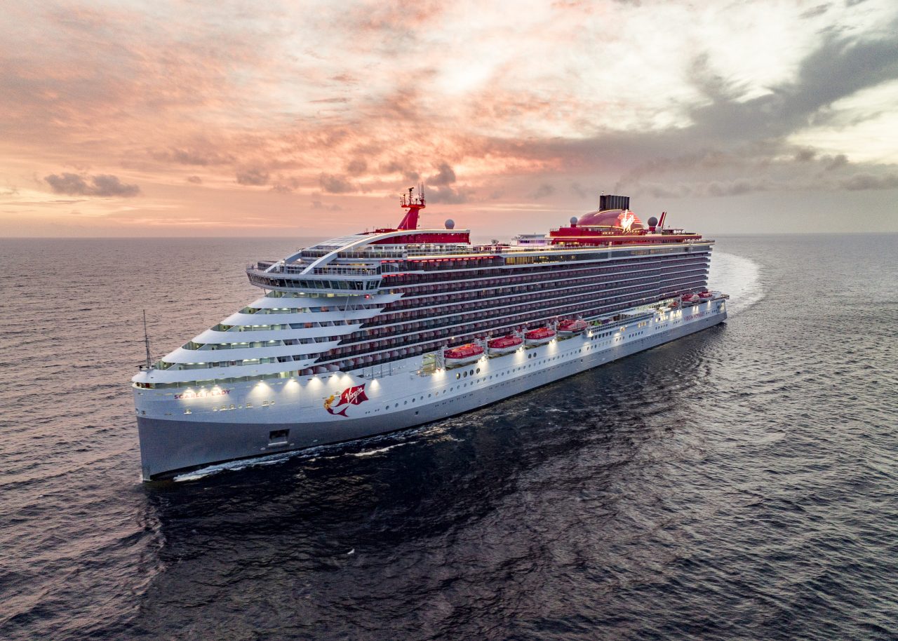 Virgin Voyages- The Scarlet Lady ship at sea during sunset